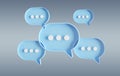 Minimalist blue and white speech bubbles talk icons floating over grey background. Modern conversation or social media messages Royalty Free Stock Photo