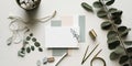 Minimalist branding, business card mockup with a stack of cards in a small bowl, boho necklace and eucalyptus twigs Royalty Free Stock Photo