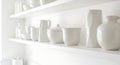 Clean White Ceramic Kitchenware Displayed on Shelves Royalty Free Stock Photo