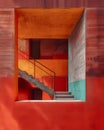 Minimalist Brutalist Architecture Staircase Leading to Vibrant Red Wall with Art Focus