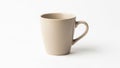 A minimalist ceramic mug with a simple handle placed against a plain background Royalty Free Stock Photo