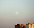 Minimalist cityscape with blue sky, white moon and urban dwelling houses skyscrapers. Landscape sunset Royalty Free Stock Photo