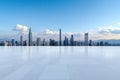 Minimalist cityscape with empty square floor and towering buildings in background Royalty Free Stock Photo
