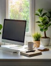 Minimalist clean white desk with computer, plant and cup of coffee. Royalty Free Stock Photo