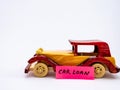A minimalist close up shot of one vintage car toy against white background for loan concept Royalty Free Stock Photo