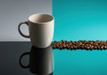 Minimalist Coffee Mug and Roasted Beans on Reflective Surface Royalty Free Stock Photo