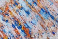 Minimalist colourful textured background of old and rusted whit, blue, brown and orange paing on metallic surface, in direct sun