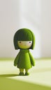 Minimalist, small figure made of wool, felt in the color green on a white background