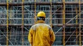 A minimalist composition featuring the back view of an engineer or architect worker against