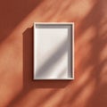 Blank White Frame on Textured Orange Wall with Sunlight Shadows Royalty Free Stock Photo