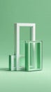 A minimalist composition featuring glass frames in varying sizes and a soft green background. Royalty Free Stock Photo