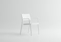Minimalist composition featuring a modern white chair against a monochromatic Royalty Free Stock Photo