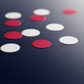 Scattered Red and White Circles on Dark Background Royalty Free Stock Photo