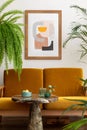 Minimalist composition of retro vintage style living room interior with yellow sofa, marble coffee table, mock up poster frame, Royalty Free Stock Photo