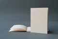 Minimalist composition of a soft pillow and a tall rectangular object on a gray background Royalty Free Stock Photo