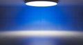 Minimalist concrete room illuminated by blue light Royalty Free Stock Photo