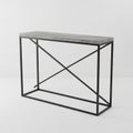 Minimalist Console Table with Concrete Top and Black Metal X- Frame Base entryway table Royalty Free Stock Photo