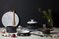 minimalist cooking setup, with sleek and stylish cookware, plates, and ingredients