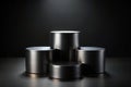 Three black cylindrical podiums on a black background Royalty Free Stock Photo