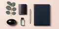 Minimalist desk flat lay with notebook and eucalyptus Royalty Free Stock Photo