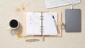 Minimalist desk setup with coffee and planner Royalty Free Stock Photo