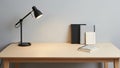 A minimalist desk setup featuring a wooden table with a light gray surface Royalty Free Stock Photo