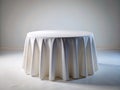 A Minimalist Dining Experience Elegant Round Table with White Linen Perfect for a Modern LowLight Setting Royalty Free Stock Photo