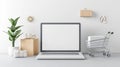 Minimalist E-commerce Setup Featuring Laptop and Shopping Cart on Stylish Table Creating Modern Online Shopping Atmosphere Royalty Free Stock Photo