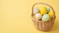 Minimalist Easter Basket with Colorful Decorated Eggs on Yellow Background Royalty Free Stock Photo