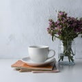Minimalist elegance white cup on table against white backdrop