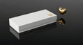 Elegant White Gift Box with Golden Heart Accent on Reflective Surface Royalty Free Stock Photo