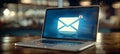 Minimalist envelope icons on laptop screen displaying geometric emails for efficient organization