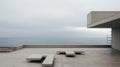 Minimalist Expressionist Architecture: Terrace Of An Empty Building Near The Ocean Royalty Free Stock Photo