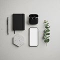 Minimalist flat lay featuring a silver pen a black notebook black wireless Royalty Free Stock Photo