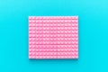 Minimalist flat lay photo of pink plastic blocks with copy space