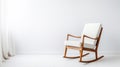 Minimalistic White Rocking Chair With Golden Frame