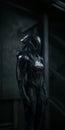 Futuristic black power suit with helmet for woman, minimalist design, dark background Royalty Free Stock Photo