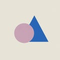A minimalist geometric design featuring a pink circle overlapping a blue triangle set Royalty Free Stock Photo