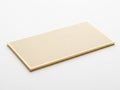 Minimalist gold-toned rectangle object on plain background isolated on white background Royalty Free Stock Photo