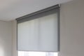 Minimalist gray roller blind in modern interior. Royalty Free Stock Photo