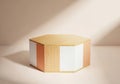 Minimalist hexagonal pedestal with warm sunlight and shadow play Royalty Free Stock Photo