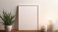 Minimalist Home Decor: Empty Frame, Candle, And Living Plant On White Wall