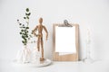 Minimalist home decor with empty frame mock-up on white wall background Royalty Free Stock Photo