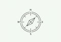 A minimalist illustration of a compass rose on a light background. Royalty Free Stock Photo