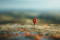A minimalist image featuring a single red location pin on a detailed map background. Ideal for navigation apps, travel Royalty Free Stock Photo