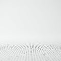 A minimalist image showing a pattern of small, evenly spaced black dots on a white Royalty Free Stock Photo