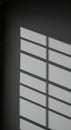 Minimalist image of sunlight filtering through blinds, casting linear shadows Royalty Free Stock Photo