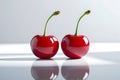 Minimalist image of Two fresh cherries with cherry leaf isolated on white background Royalty Free Stock Photo