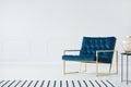 Minimalist interior with blue armchair Royalty Free Stock Photo