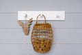 The minimalist interior design of the kitchen is decorated with a hanging white hanger and a basket of walnuts, cutting down a